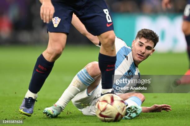 Mateo Kovacic of Croatia competes with Julian Alvarez of Argentina during the FIFA World Cup Qatar 2022 Semi-Final match between Argentina and...