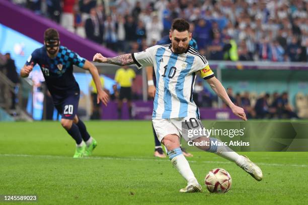 Lionel Messi of Argentina scores a goal from a penalty during the FIFA World Cup Qatar 2022 semi final match between Argentina and Croatia at Lusail...