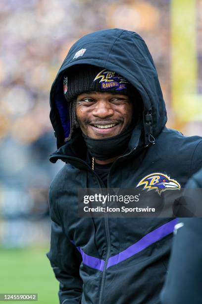 Baltimore Ravens quarterback Lamar Jackson smiles on the sideline during the national football league game between the Baltimore Ravens and the...