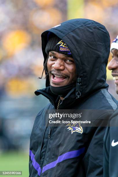 Baltimore Ravens quarterback Lamar Jackson laughs on the sideline during the national football league game between the Baltimore Ravens and the...