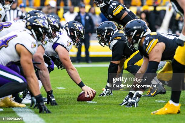 The Baltimore Ravens offensive line stares down the Pittsburgh Steelers defensive line during the national football league game between the Baltimore...