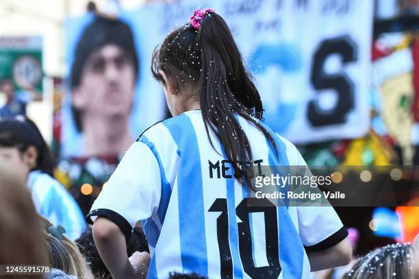 Fan of Argentina celebrates wearing a Lionel Messi jersey after the team's victory in the semi-final match of FIFA World Cup Qatar 2022 between...