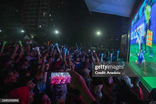 Bangladeshi football fans watch the live broadcast of the FIFA World Cup Qatar 2022 Semi-Final match between Argentina and Croatia on a big screen at...