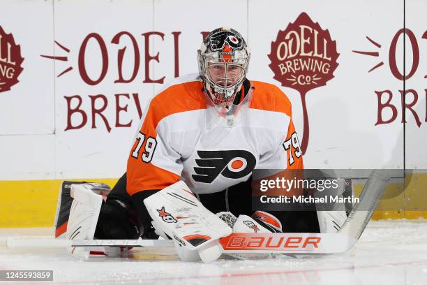 Goaltender Carter Hart of the Philadelphia Flyers stretches prior to the game against the Colorado Avalanche at Ball Arena on December 13, 2022 in...