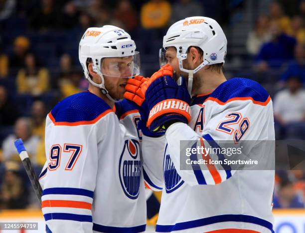 Edmonton Oilers center Connor McDavid and winger Leon Draisaitl talk during the NHL game between the Nashville Predators and Edmonton Oilers, held on...