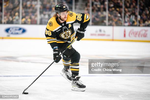 David Pastrnak of the Boston Bruins shoots the puck against the New York Islanders during the first period at TD Garden on December 13, 2022 in...