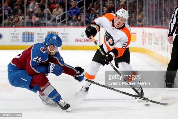 Nick Seeler of the Philadelphia Flyers skates against Logan O'Connor of the Colorado Avalanche at Ball Arena on December 13, 2022 in Denver, Colorado.