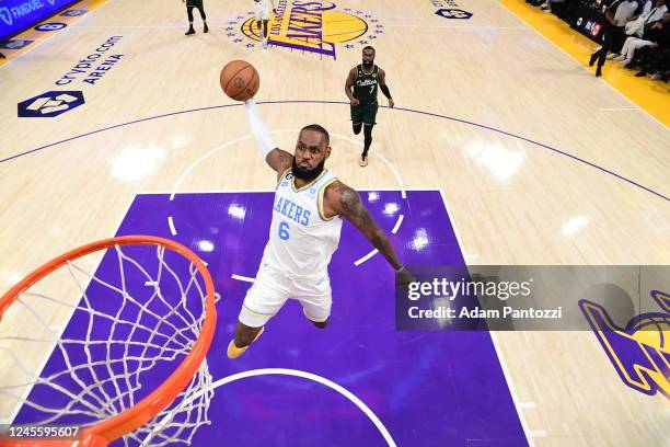 LeBron James of the Los Angeles Lakers dunks the ball during the game against the Boston Celtics on December 13, 2022 at Crypto.com Arena in Los...