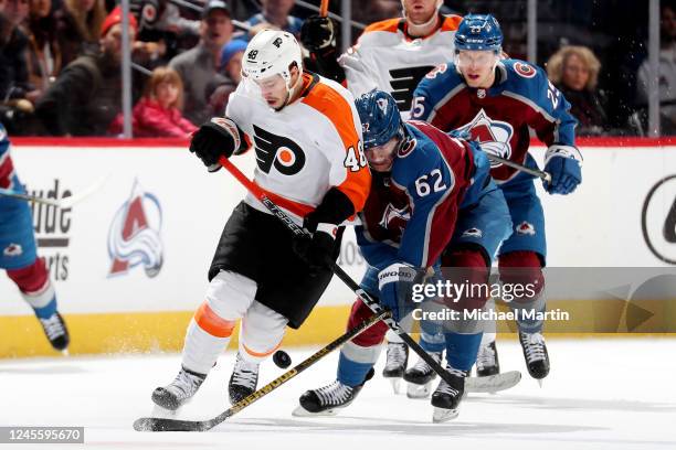 Morgan Frost of the Philadelphia Flyers skates against Artturi Lehkonen of the Colorado Avalanche at Ball Arena on December 13, 2022 in Denver,...