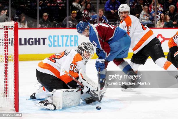 Goaltender Felix Sandstrom of the Philadelphia Flyers eyes a loose puck during the third period against the Colorado Avalanche at Ball Arena on...