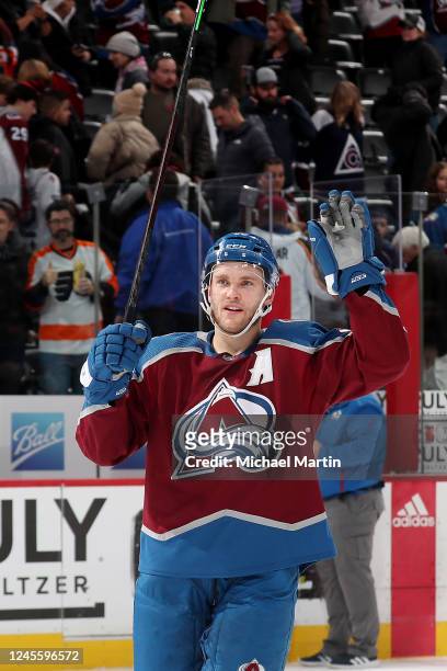 Mikko Rantanen of the Colorado Avalanche waves to fans after the game against the Philadelphia Flyers at Ball Arena on December 13, 2022 in Denver,...