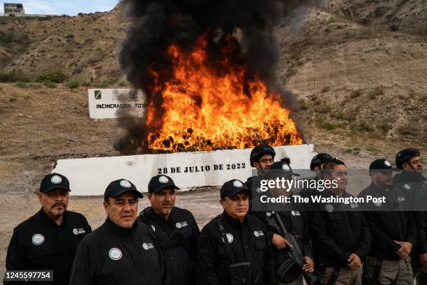 Officials from the Mexican attorney generals office burn thousands of pounds of drugs, including tens of thousands of counterfeit fentanyl pills, at...