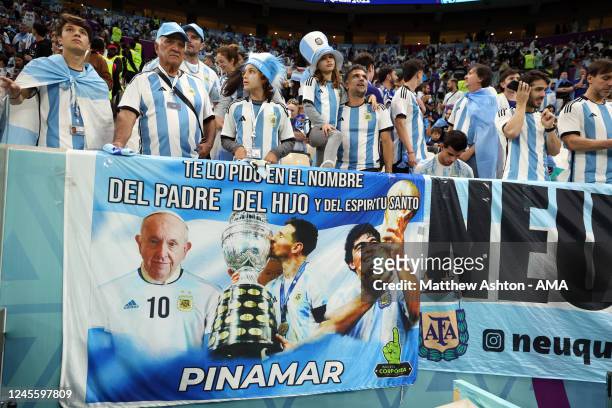 fans-of-argentina-in-front-of-a-banner-f