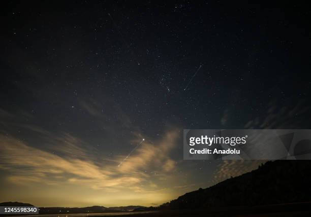 The Geminid meteor shower lights up the night sky at Point Reyes Shipwrecks in Inverness, California, United States on December 13, 2022.