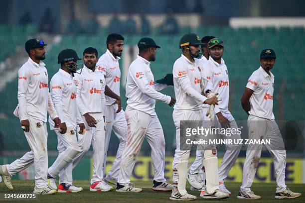 Bangladesh's cricketers walks back to the pavilion after end of play during the first day of the first cricket Test match between Bangladesh and...