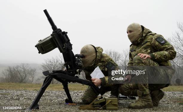 Volunteers and special force troopers are put through their paces during military training at a "Russian University of Special Forces" training...