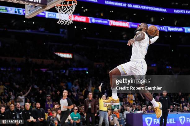 Los Angeles, CA, Tuesday, December 13, 2022 - Los Angeles Lakers forward LeBron James swoops in for a dunk against the Boston Celtics at Crypto.Com...