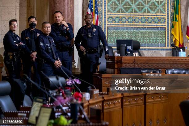 Los Angeles, CA LAPD officers keep an eye on protesters in the audience in the council chambers where embattled city councilman Kevin De Leon makes...