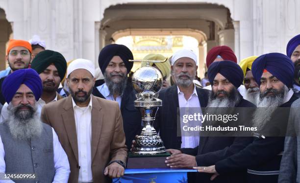 Shiromani Gurdwara Parbandhak Committee officials and Hockey officials with the FIH Hockey World Cup during Trophy Tour outside the Golden Temple on...