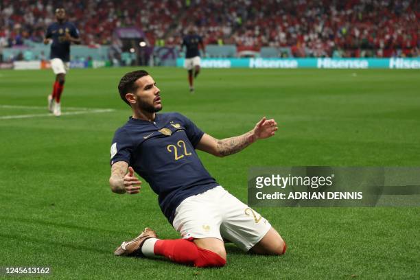 France's defender Theo Hernandez celebrates scoring his team's first goal during the Qatar 2022 World Cup semi-final football match between France...