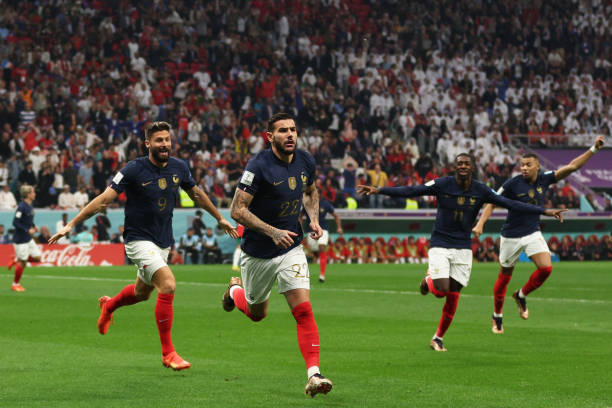 France's defender Theo Hernandez celebrates scoring his team's first goal during the Qatar 2022 World Cup semi-final football match between France...