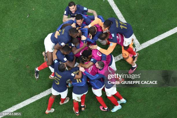 France's forward Randal Kolo Muani celebrates with teammates after he scored his team's second goal during the Qatar 2022 World Cup semi-final...