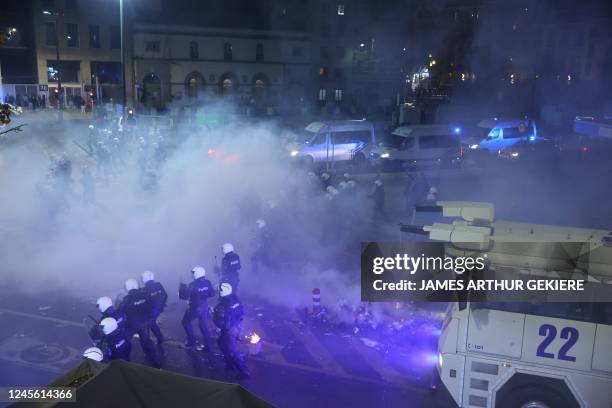 Illustration picture shows police, as small riots break out, in the streets of Brussels city center, after Morocco lost the semi-final match of...