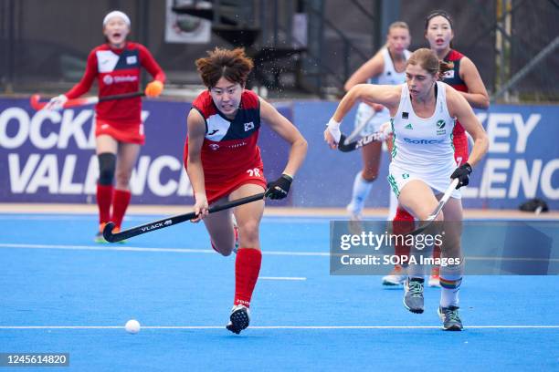 Jiyun Choi of Korea and Kathryn Mullan of Ireland seen in action during the FIH Hockey Womens Nations Cup Spain 2022 at Poliesportiu Municipal Verge...