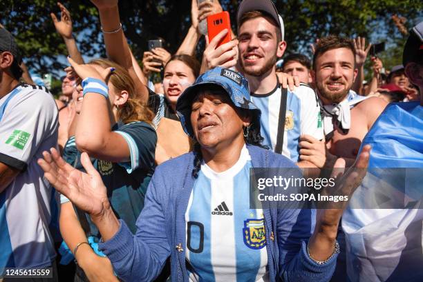 An Argentine soccer fan gestures while watching their team's FIFA World Cup semi-final match against Croatia at the World Cup, hosted by Qatar, in...