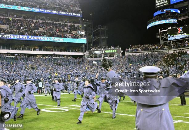 Army cadets run on to the field following the 123rd playing of the Army Navy game on December 10, 2022 at Lincoln Financial Field in Philadelphia, PA.