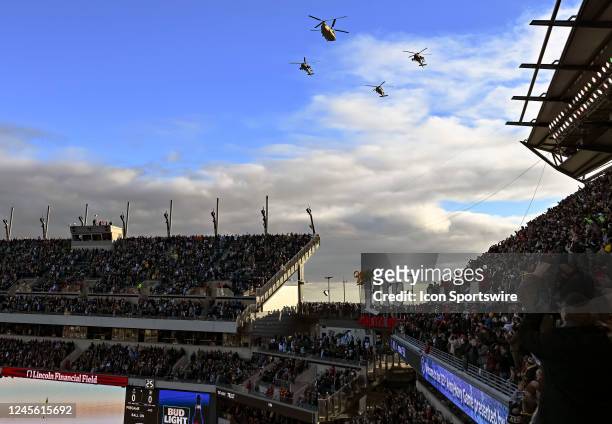 Four Army helicopters fly over the stadium at the start of the 123rd playing of the Army Navy game on December 10, 2022 at Lincoln Financial Field in...