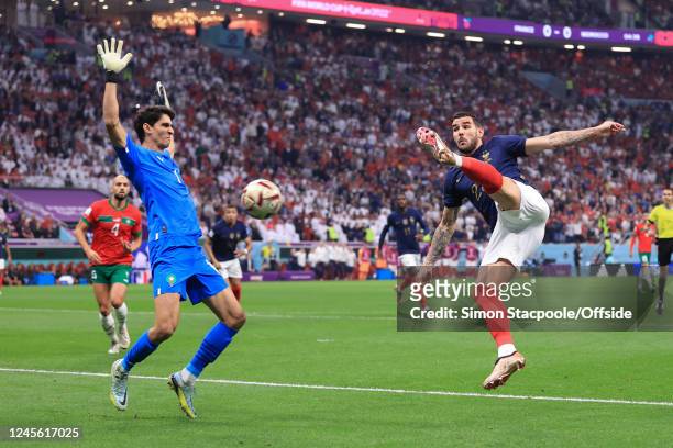 Theo Hernandez of France scores their first goal past Morocco goalkeeper Yassine Bounou during the FIFA World Cup Qatar 2022 semi final match between...