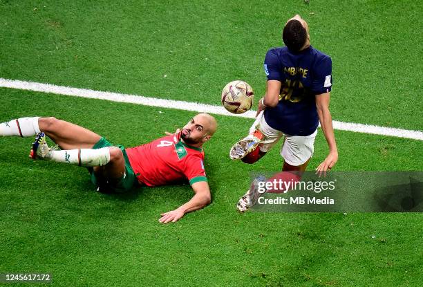 Kylian Mbappe of France competes for the ball with Sofyan Amrabat of Morocco ,during the FIFA World Cup Qatar 2022 semi final match between France...