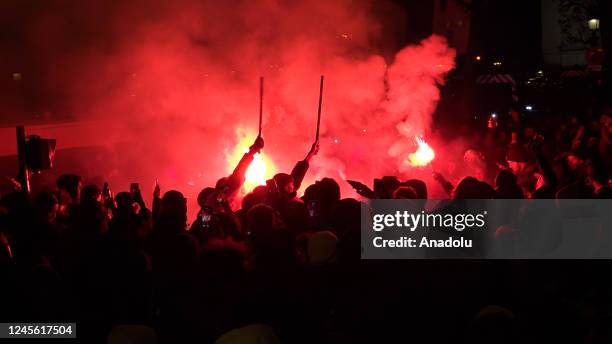 Fans of France celebrate victory after France defeated Morocco in FIFA World Cup Qatar 2022 semi-final match at Champs Elysees in Paris, France on...