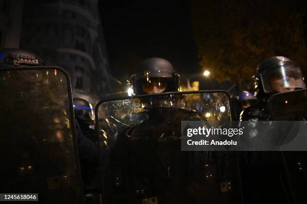 Fans clash with police as fans of France celebrate victory after France defeated Morocco in FIFA World Cup Qatar 2022 semi-final match in Paris,...