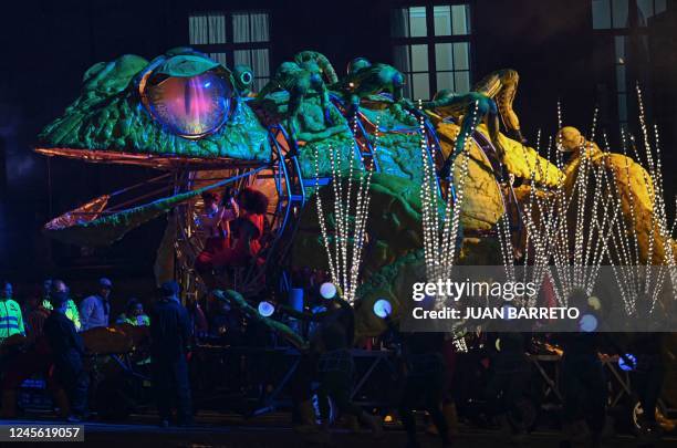 View of a giant doll depicting a frog during the Christmas Lights Festival at Bolivar square in Bogotá on December 14, 2022.
