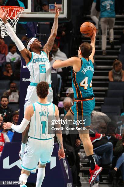 Jalen McDaniels of the Charlotte Hornets plays defense against the Detroit Pistons on DECEMBER 14, 2022 at Spectrum Center in Charlotte, North...