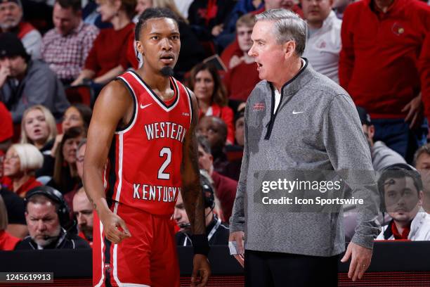 Western Kentucky Hilltoppers head coach Rick Stansbury talks to guard Jordan Rawls during a college basketball game against the Louisville Cardinals...