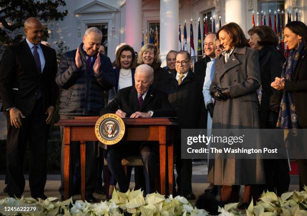 President Joe Biden signs the Respect for Marriage Act during a ceremony on the South Lawn, in Washington, DC.