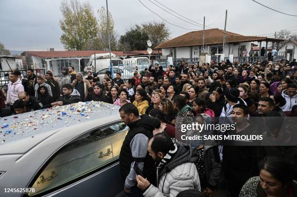 Relatives and friends of the 16-year-old Roma boy who was shot in the head by Greek police follow a hearse with the coffin during the funeral, in...