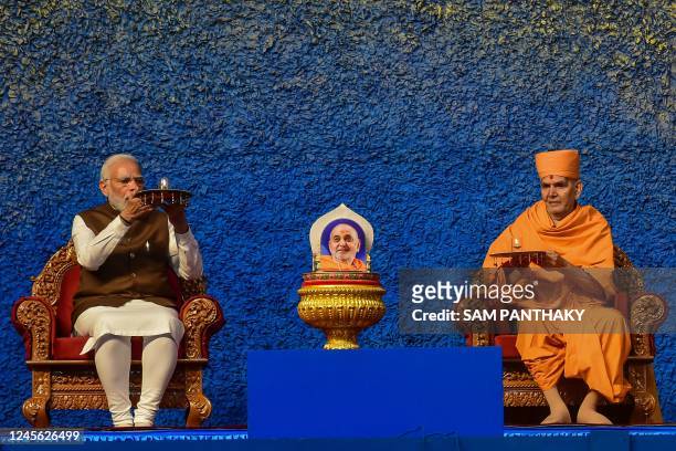 In this picture taken on December 14 Indias prime minister Narendra Modi attends the birth centenary celebration of Pramukh Swami Maharaj on the...
