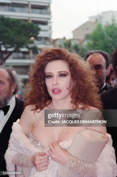 Italian actress Francesca Dellera arrives for the showing of the film "The Flesh", on May 13 at the 44th annual Cannes Film Festival 1991.
