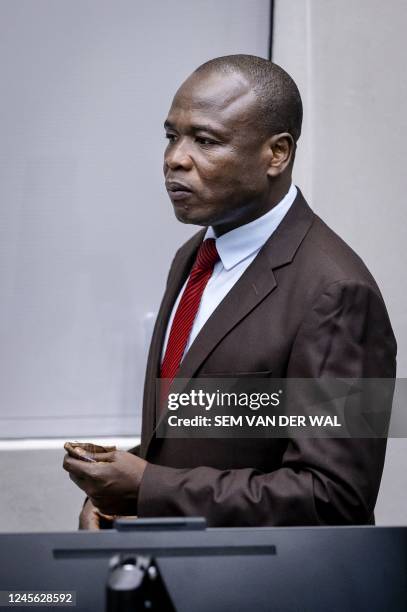 Ugandan former child soldier Dominic Ongwen looks on prior to the ruling in the appeal at the International Criminal Court, in The Hague on December...