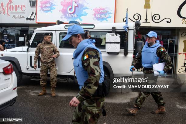 Irish UN peacekeepers check the site where a UN peacekeeping force UNIFIL convoy came under small arms fire, in the village of al-Aqbiya in south...