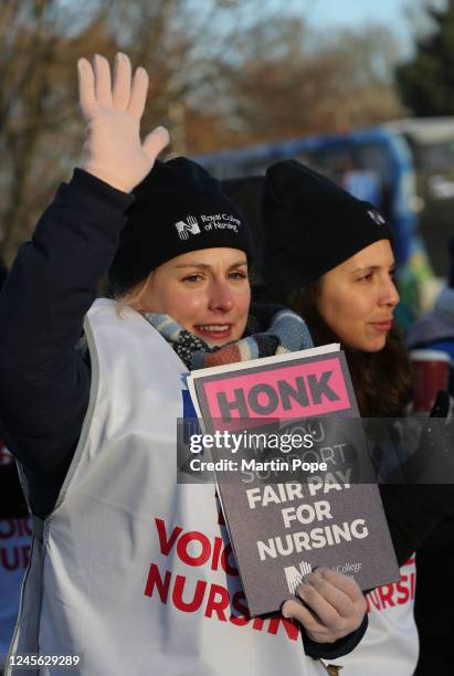Nurses on the picket line outside Addenbrookes hospital on Hills Road hold signs up for support from the passing traffic on December 15, 2022 in...