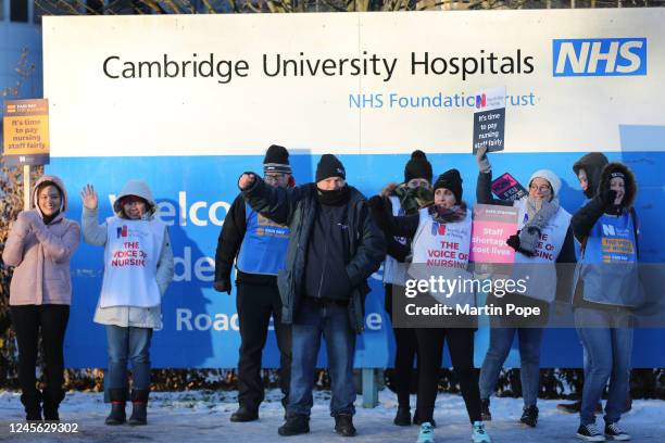 Nurses on the picket line outside Addenbrookes hospital on Hills Road hold signs up for support from the passing traffic on December 15, 2022 in...