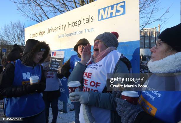 Those on the picket line outside Addenbrookes hospital shout their message of fair pay on December 15, 2022 in Cambridge, United Kingdom. The Royal...