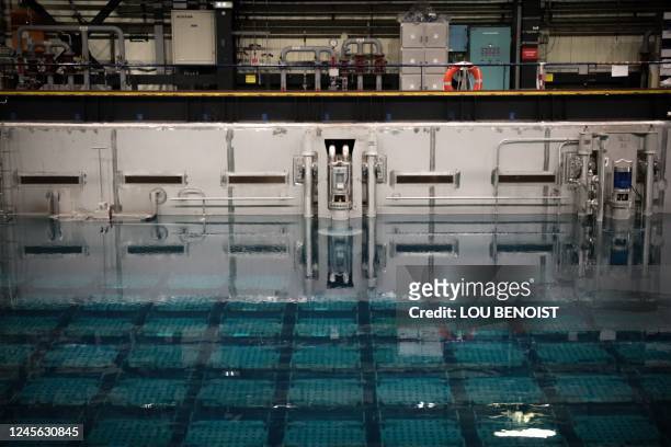 This photograph taken on December 14 shows a nuclear spent fuel pool at the Orano la Hague reprocessing plant, in La Hague, northwestern France. - A...