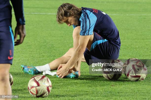 Croatia's midfielder Luka Modric takes part in a training session at Al Erssal Training Site 3 in Doha on December 15 ahead of their third place...