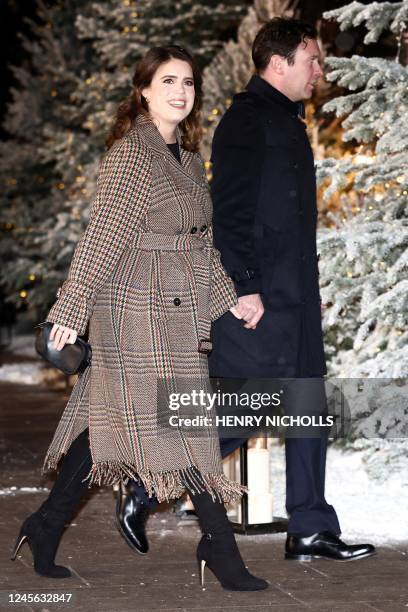 Britain's Princess Eugenie of York and her husband Jack Brooksbank arrive to attend the "Together At Christmas Carol Service" at Westminster Abbey,...